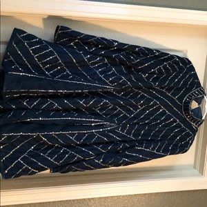A blue encrusted beautiful dress, new with tag!